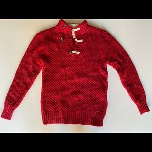 Cozy knit sweater with button neck and faux fur